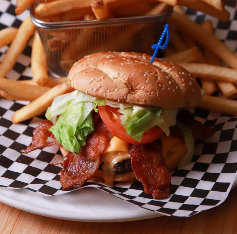 Bacon Cheeseburger with fries at Monty's Pizza restaurant in Edmonton, AB